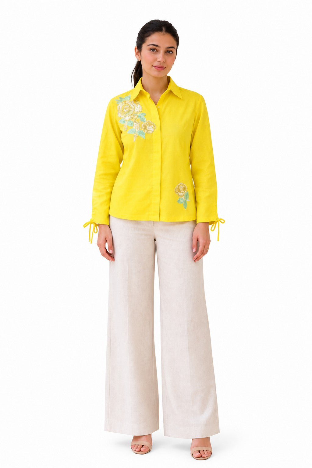 Bright yellow shirt with delicate floral embroidery and playful tie-up cuffs for a feminine finish.
