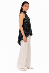 Flowing A-line silhouette with an asymmetrical curved hem for graceful movement and effortless style.