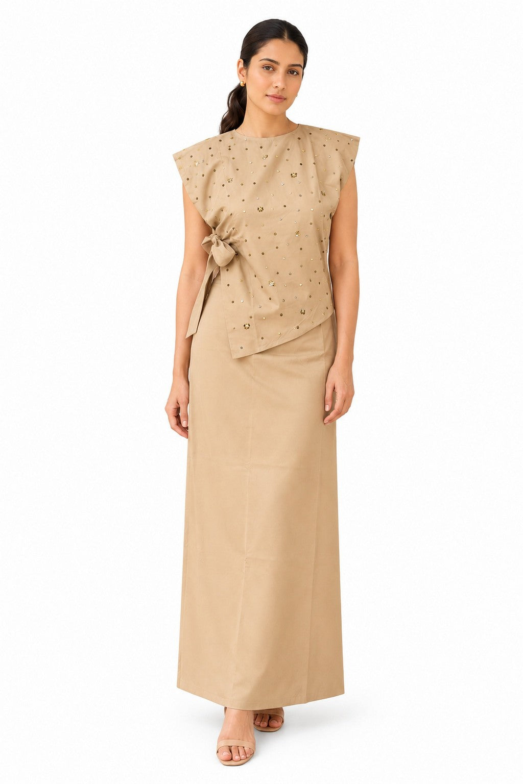 Elegant beige coord set featuring a structured cap-sleeve top with delicate scattered embellishments and a feminine side bow detail.