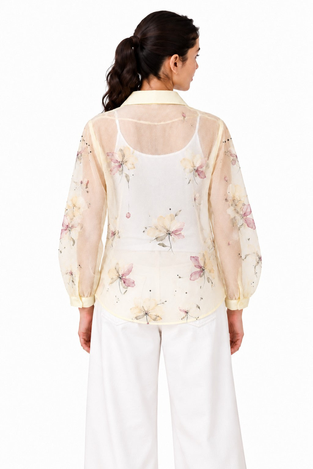 Lightweight ivory sheer finish with scattered pastel florals, a structured collar, and a softly rounded relaxed silhouette.