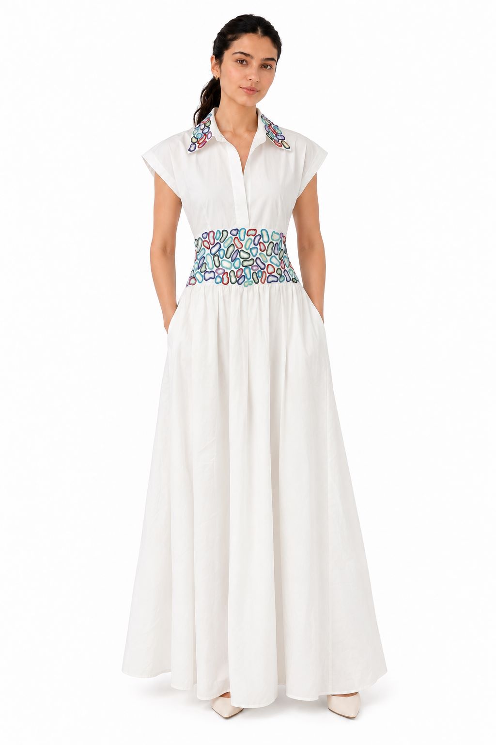 Elegant white maxi dress featuring a classic collar, cap sleeves, and vibrant multicoloured embroidered detailing across the collar and waist.