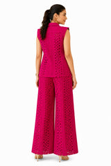 Clean cutwork vest with a structured back and matching wide-leg trousers, showcasing the intricate laser-cut texture throughout.