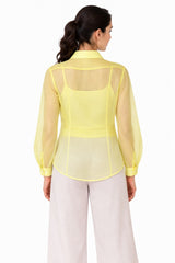 Clean sheer yellow finish with a relaxed curved hem and subtle translucent detailing for an effortless look
