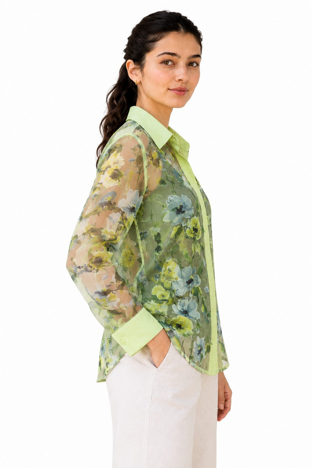 Relaxed silhouette with translucent long sleeves, curved hem, and delicate floral detailing creating a soft, effortless drape.