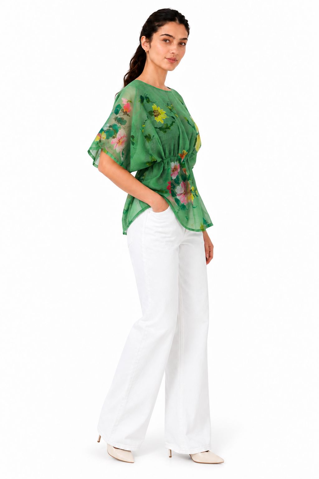 Relaxed side profile with flowing sheer fabric, short sleeves, and an elasticated waist creating a softly defined shape