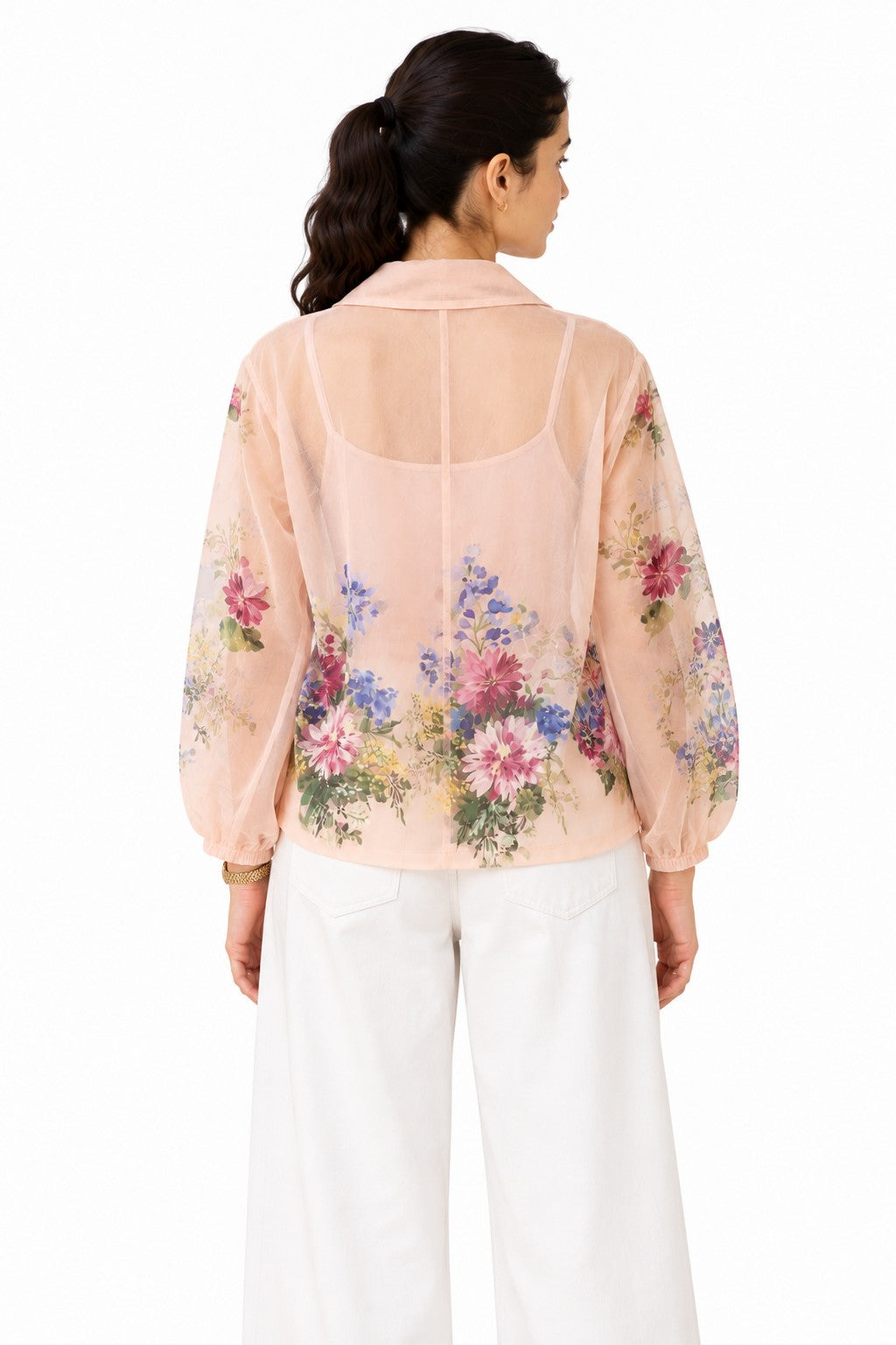 Airy blush-pink sheer finish with a softly draped collar and floral detailing extending across the lower back and sleeves.