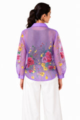 Airy lilac sheer finish with an expressive floral print, structured collar, and relaxed curved hem.