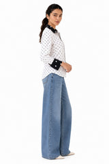 Relaxed curved silhouette with long sleeves, statement contrast cuffs