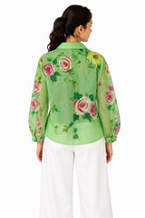 Airy green sheer finish with an all-over rose floral print, classic collar, and relaxed curved silhouette.