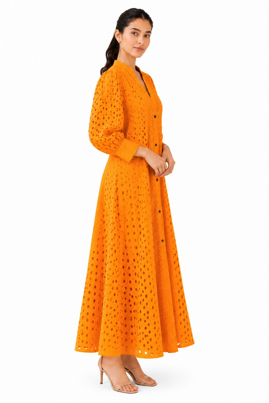 Relaxed A-line silhouette with softly gathered sleeves and a flowing flare