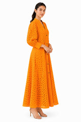 Relaxed A-line silhouette with softly gathered sleeves and a flowing flare