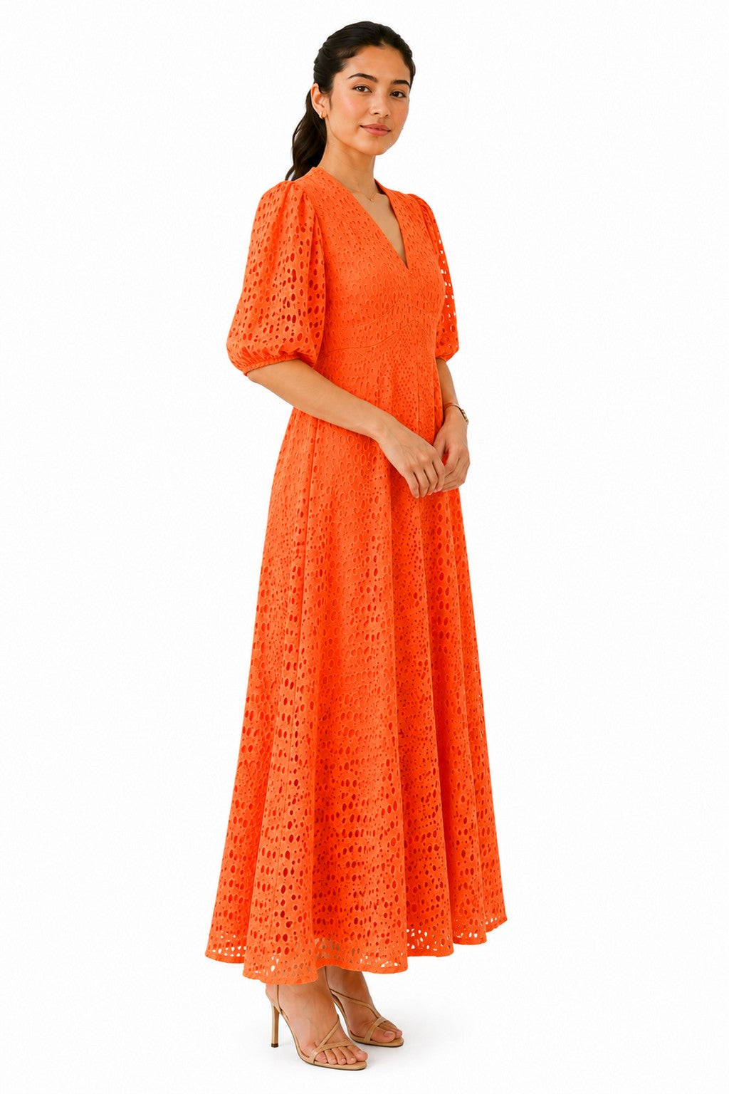 Flowing A-line silhouette with voluminous puff sleeves and delicate cutwork