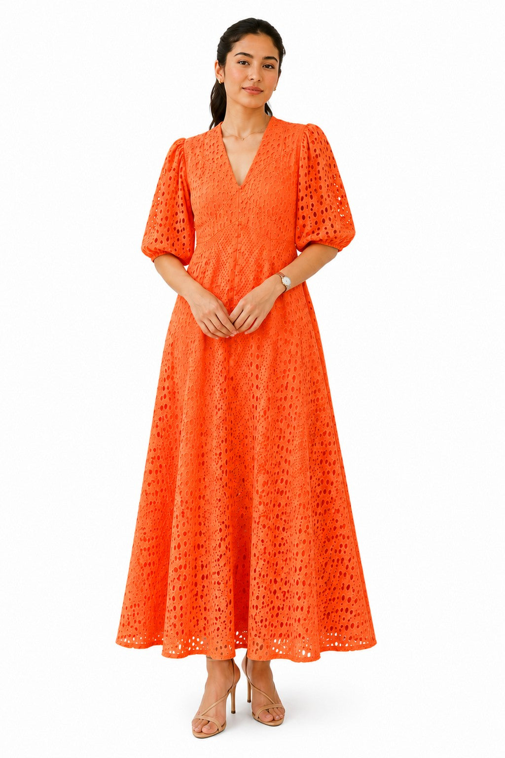 Vibrant orange midi dress featuring a flattering V-neckline, sculpted waist, puff sleeves, and intricate all-over cutwork detailing.