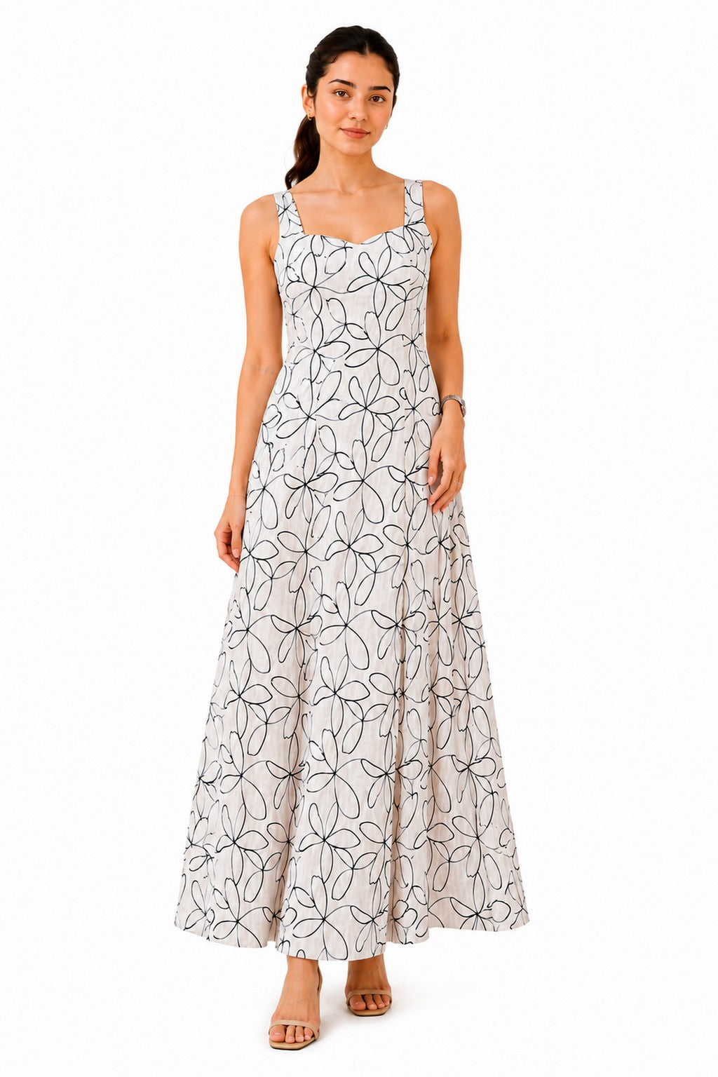 Elegant white maxi dress with wide shoulder straps, a flattering square neckline, and an all-over black floral line-art print.