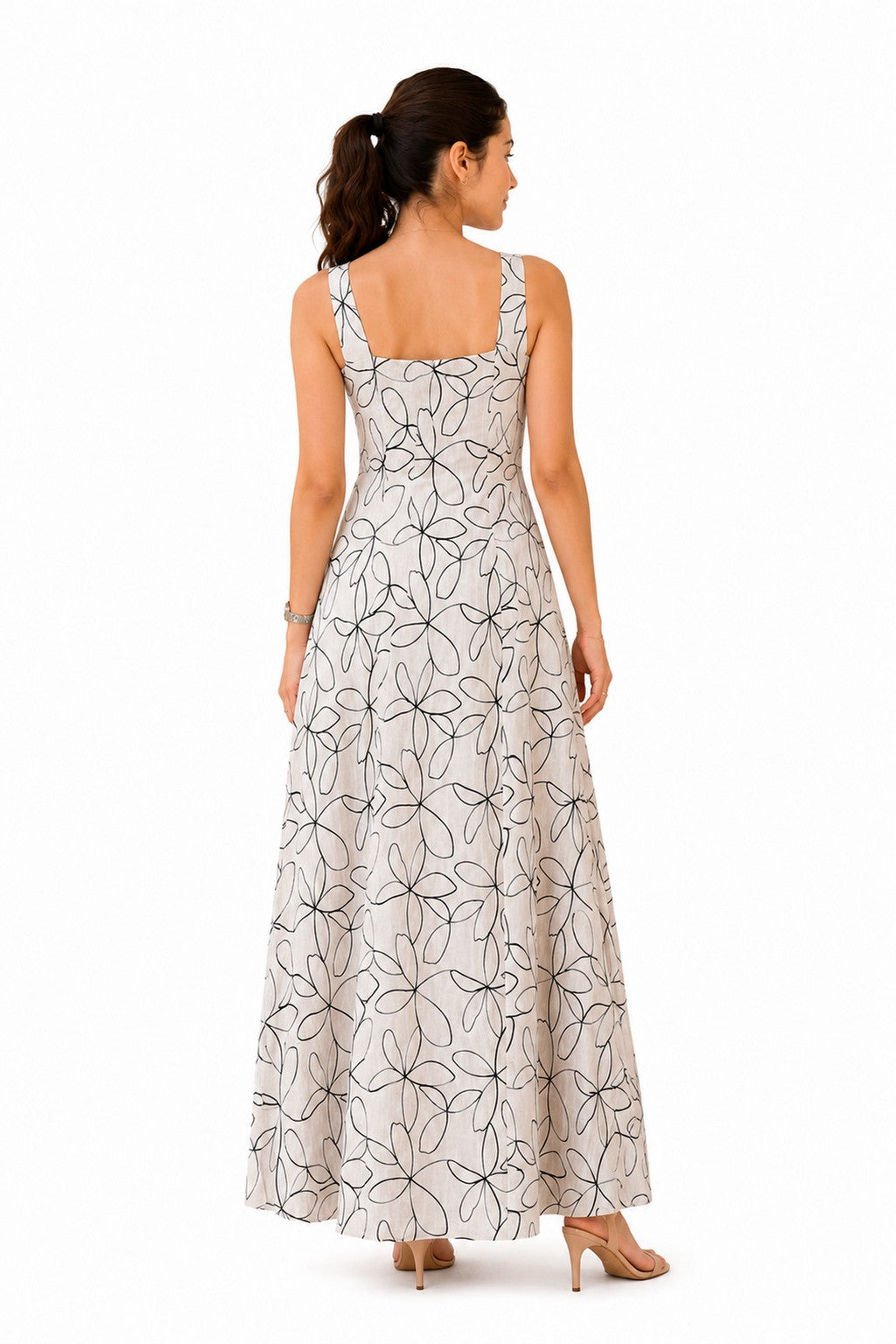 Clean floral-print back with wide straps, a structured bodice, and a full-length flared skirt.