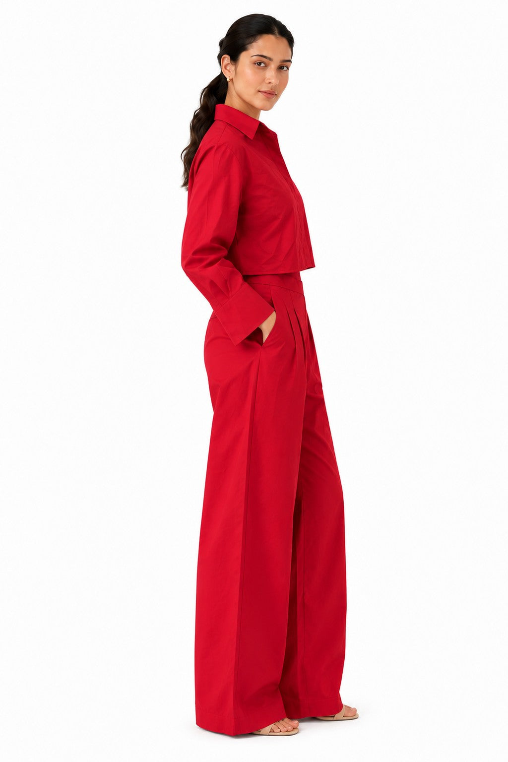 Cropped shirt silhouette paired with high-waisted, pleated wide-leg trousers