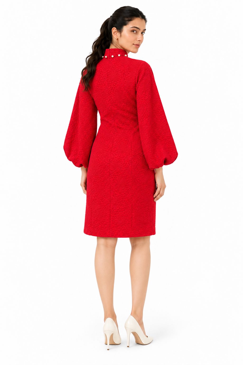 Clean, refined back with the same floral-textured fabric, high neckline, long sleeves, and straight mini-length hem.