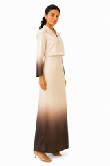 Structured cropped blazer silhouette with defined shoulders and fitted waist, transitioning into a sleek, floor-length gradient skirt.