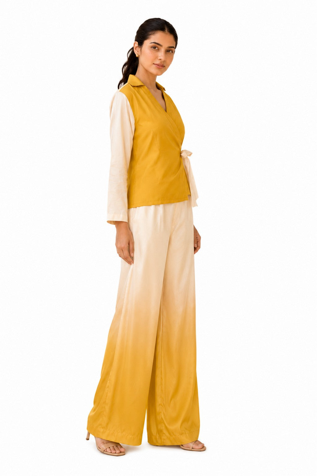 Flattering wrap silhouette with a defined waist, flowing sheer sleeves, and a softly structured hem.