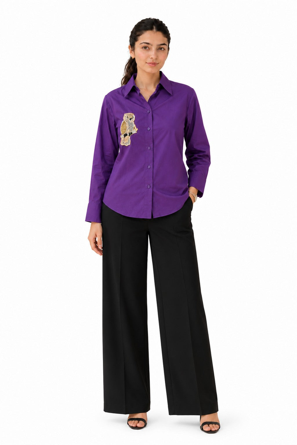 Rich purple button-down shirt featuring a distinctive embroidered character motif on the chest